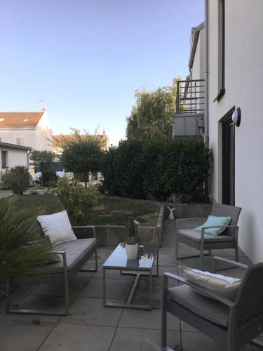 Coin salon dans l'établissement Appartement Résidence en rez-de-chaussée Les Jardins de Diane