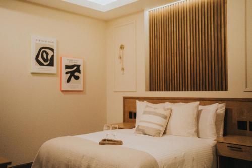 Cama ou camas em um quarto em Jules & Laurent Hotel Contemporaneo