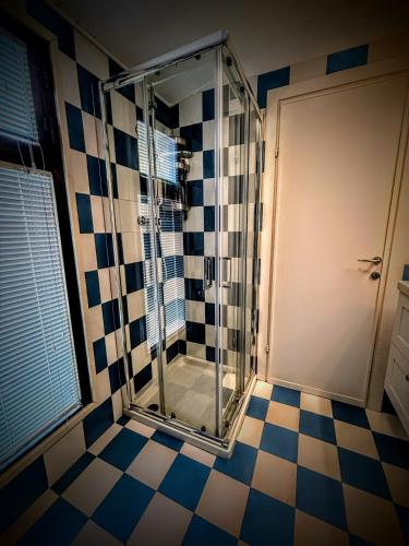 a shower with a glass door in a bathroom at Deluxe Apartament - Marina di Carrara - in Marina di Carrara