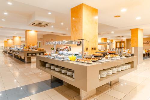 a buffet in a hotel with food on display at HOVIMA Santa Mar&iacute;a in Adeje