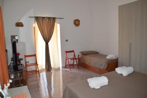 A bed or beds in a room at Casetta in Salento