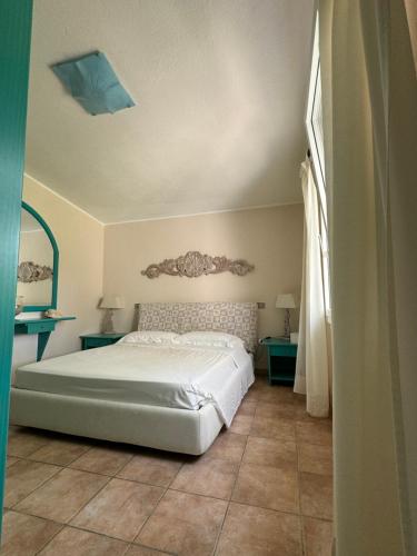 Postel nebo postele na pokoji v ubytování Villa Caroline - Notteri a Villasimius