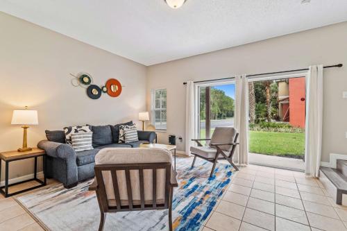 a living room with a couch and a table at 8400 Blue Lagoon Drive in Kissimmee