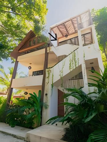 a house with stairs leading up to it at Casa de Piedra - Departamentos Bacalar- in Bacalar