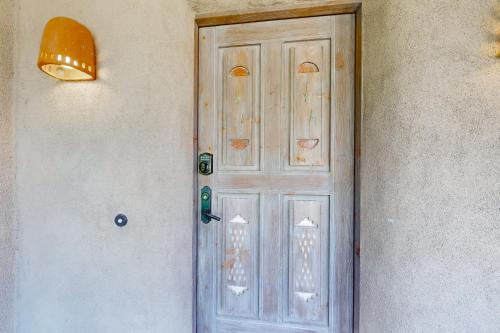 a door on the side of a building at Casa del Sueños in Taos