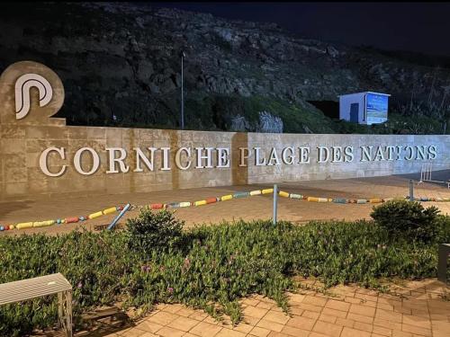 a sign for the corriente place dstg nations at Appt magnifique vue mer et piscine spacieuse in Sidi Bouqnadel