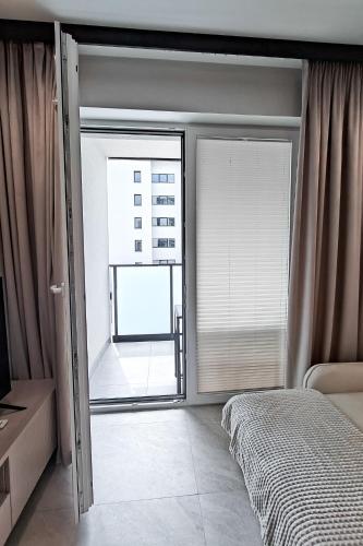Katil atau katil-katil dalam bilik di Apartament Osiedle Kresów Wschodnich