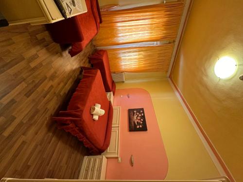 an overhead view of a living room with wood floors at Fly in Viareggio beach in front of the famous promenade with shops and establishments in Viareggio
