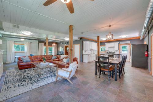 a living room with a couch and a table at Peaceful Warrenville Home 1 Mi to Herrick Lake! in Warrenville