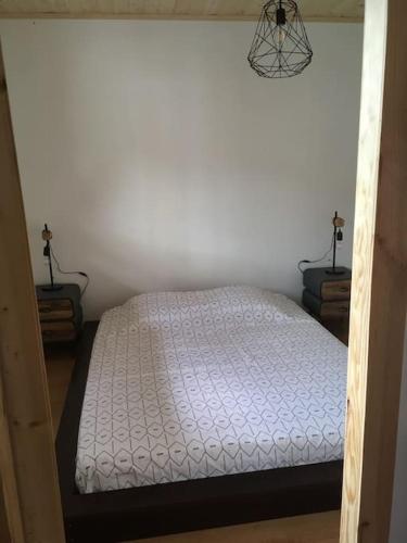 Una cama o camas en una habitación de Appartement le Syöté