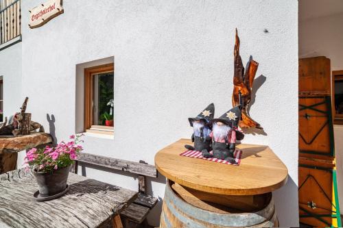 a table with a figurine on top of it at Engethalerhof in Pavicolo