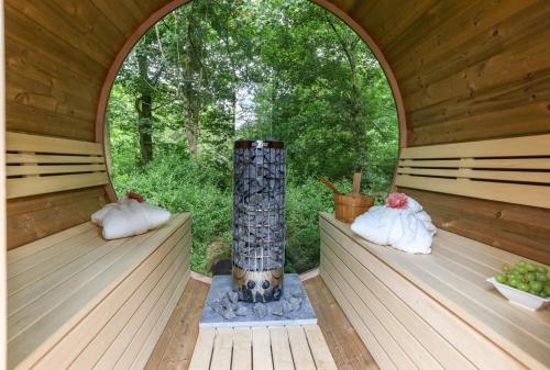 an inside view of a sauna with a round window at NEW Hello Zeeland - Watervliet View Lodge in Wissenkerke