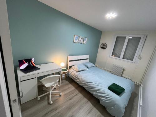 Katil atau katil-katil dalam bilik di Appartement Prestige - Amiens
