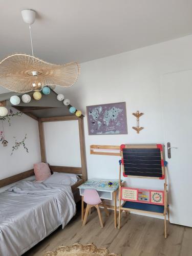 a bedroom with a bunk bed and a desk at Disney - Résidence Juan Valera in Vaujours