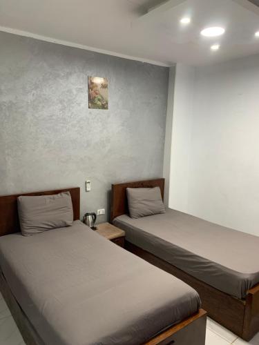 Postel nebo postele na pokoji v ubytování Abo Stait - Pyramid View Homestay