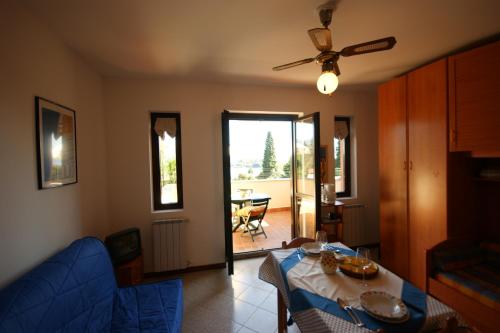 a living room with a table and chairs and a dining room at Martino Serena in Someraro