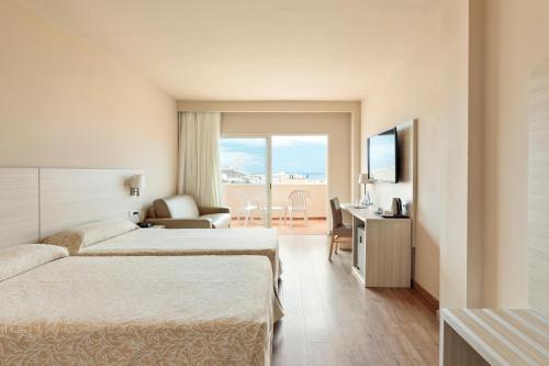 Letto o letti in una camera di Hotel Best Jacaranda