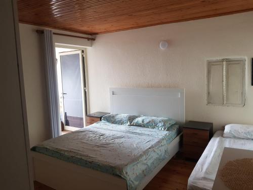 Postel nebo postele na pokoji v ubytování Kakuli Home