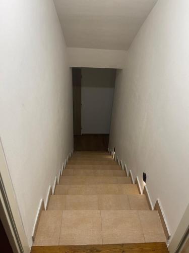 an empty hallway with stairs in a house at Hostel u Arény in Ostrava