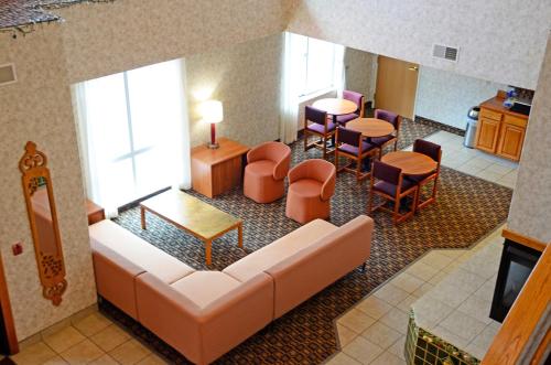 an overhead view of a waiting room with a couch and chairs at Budget Host Inn in Allegan