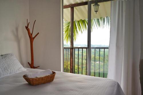Cama o camas de una habitación en Hospedaje Mirador La Aurora Filandia