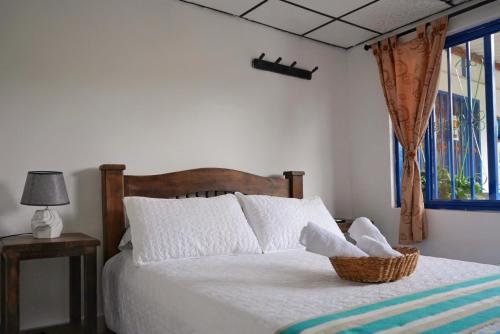Cama o camas de una habitación en Hospedaje Mirador La Aurora Filandia