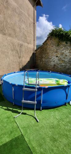 a large blue inflatable trampoline in the grass at Antiche atmosfere... in Borzonasca