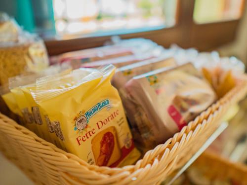 a basket filled with food on a table at B&B Villa Erika in Lugo