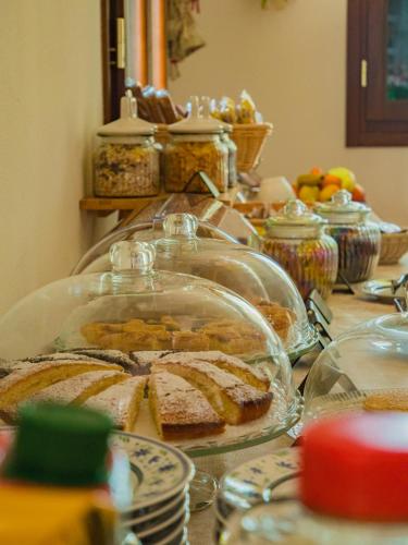 a table with a bunch of food on it at B&B Villa Erika in Lugo