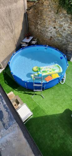 an empty pool with a chair in the middle of it at Antiche atmosfere... in Borzonasca