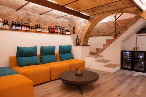 a living room with a couch and a table at Executive B&B in Scafa