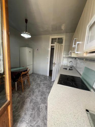 a kitchen with a sink and a counter top at Apartamento en Biescas Maribel in Biescas