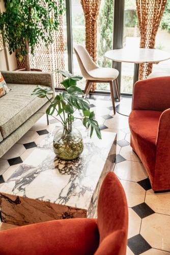 Posezení v ubytování Hôtel Le Mosaïque