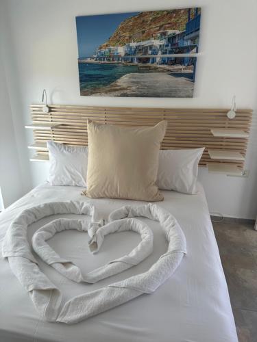 a white bed with a heart made out at Cindy Luxury Villas Crete GR in Stavros