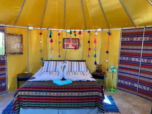 Postel nebo postele na pokoji v ubytování Altos de Quitor, Glamping