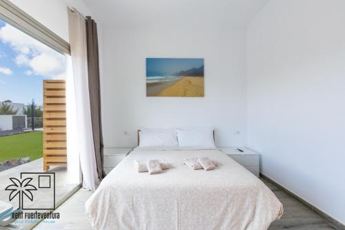 Katil atau katil-katil dalam bilik di Lola Suite Lajares iRent Fuerteventura