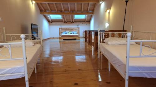 a room with three bunk beds in it at El Zaguan in Sotillo de la Adrada