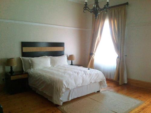 Ένα ή περισσότερα κρεβάτια σε δωμάτιο στο Havana Lodge