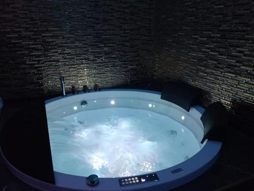 a bathroom with a jacuzzi tub in a room at Il vecchio sentiero in Acireale