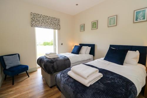 Un ou plusieurs lits dans un hébergement de l'établissement Bramble Cottage