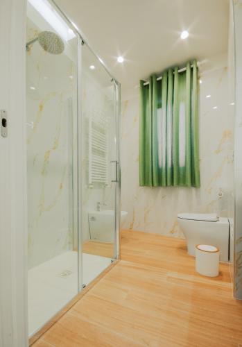 a bathroom with a shower and a toilet at Luxury Apartment near Naples, Parking, 2 bath in Frattamaggiore