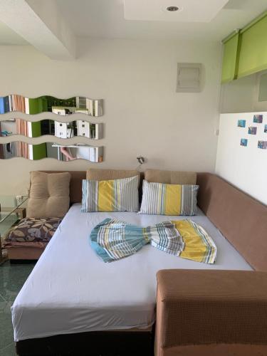 a bed with two ties on it in a room at Apartments Mila Krimovica in Krimovice