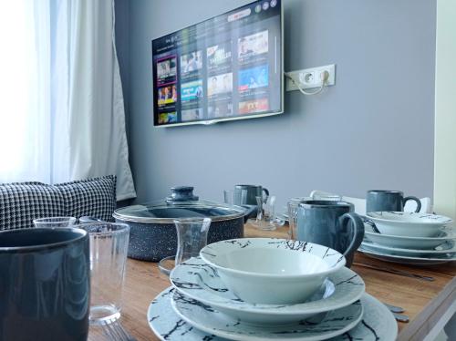 Телевизор и/или развлекательный центр в Sweet Hotel In Historical Area