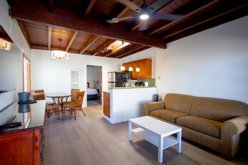 a living room with a couch and a table at Edgewater Beach Inn in Santa Cruz