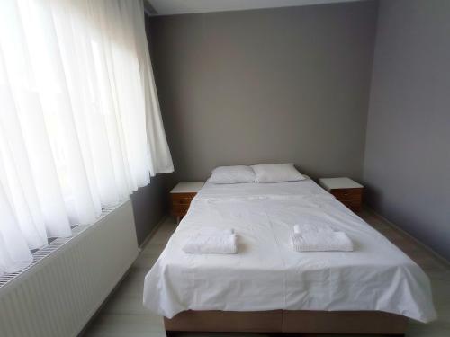 Кровать или кровати в номере Sweet Hotel In Historical Area