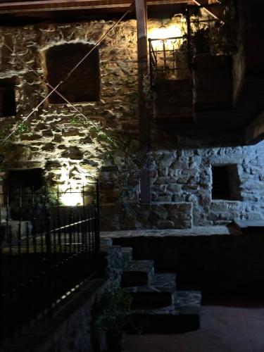 an old stone building with lights in the dark at Castello di Francocci Spoleto in Marzolini