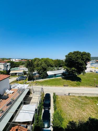 a group of cars parked on the side of a road at Rooms and Apartments Zara in Sukošan