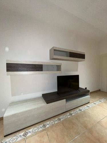 a living room with a fireplace in the wall at Villa Immacolata in Monteroni di Lecce