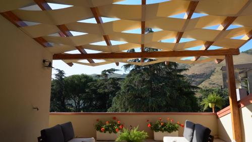 a view from a patio with a wooden ceiling at Camere al Borgo in Forchia