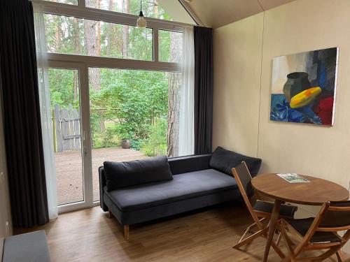 Posezení v ubytování Sea dune cottage Kalnu